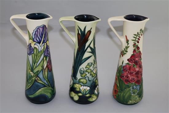 Three Moorcroft cylindrical ewers in Limia, Iris and Foxglove patterns, 1995-2002, height 24cm